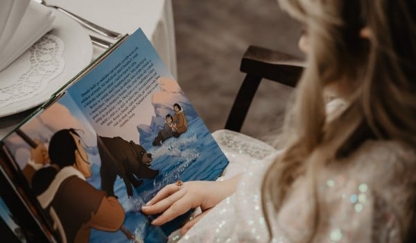 A young child reading a book